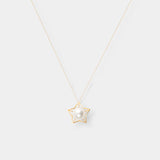 Enhance your elegance with a stunning gold star necklace adorned with a lustrous pearl. Elevate your style effortlessly.