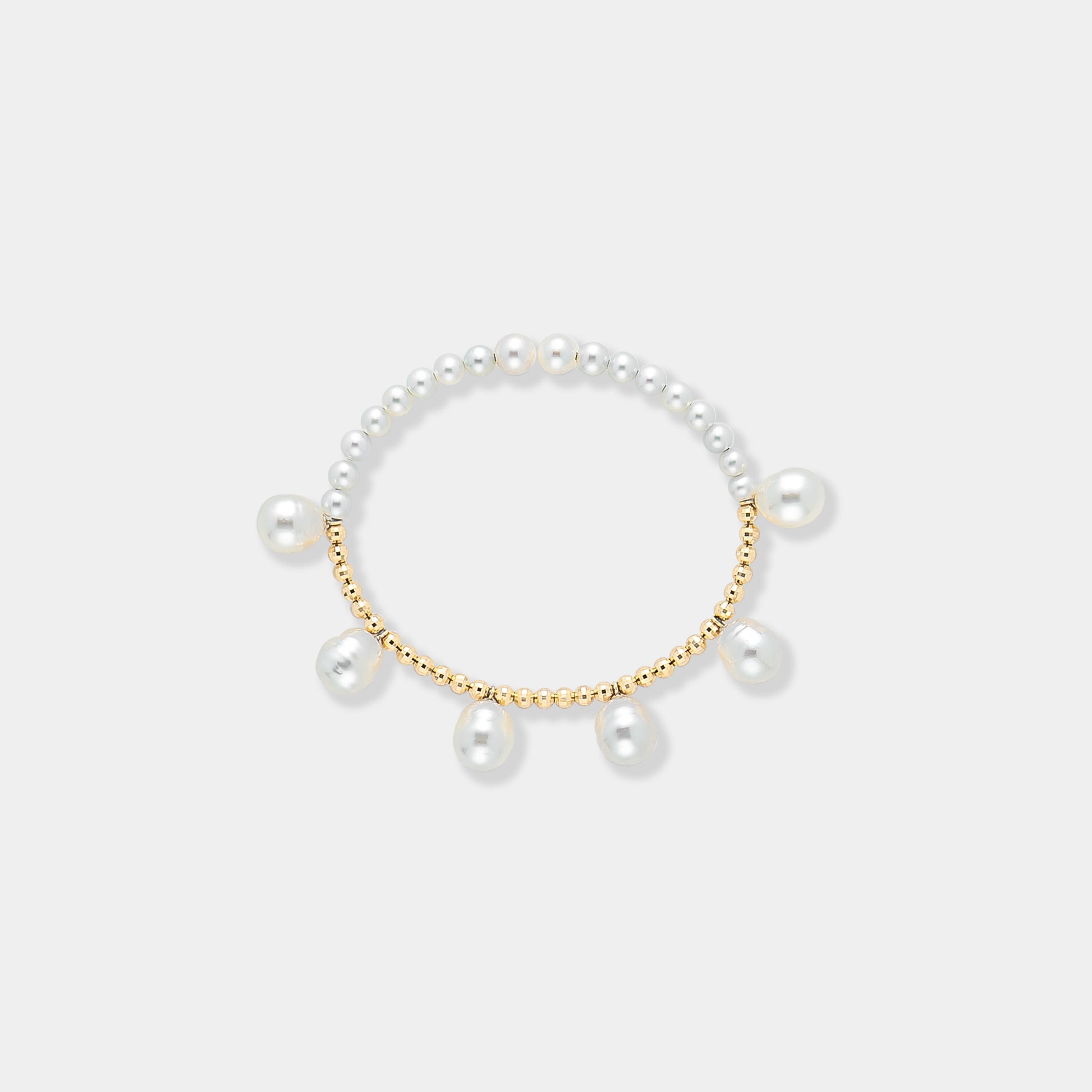 Elegant pearl bracelet with gold beads on a white background. Perfect for adding a touch of sophistication to any outfit.