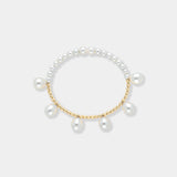 Elegant pearl bracelet with gold beads on a white background. Perfect for adding a touch of sophistication to any outfit.