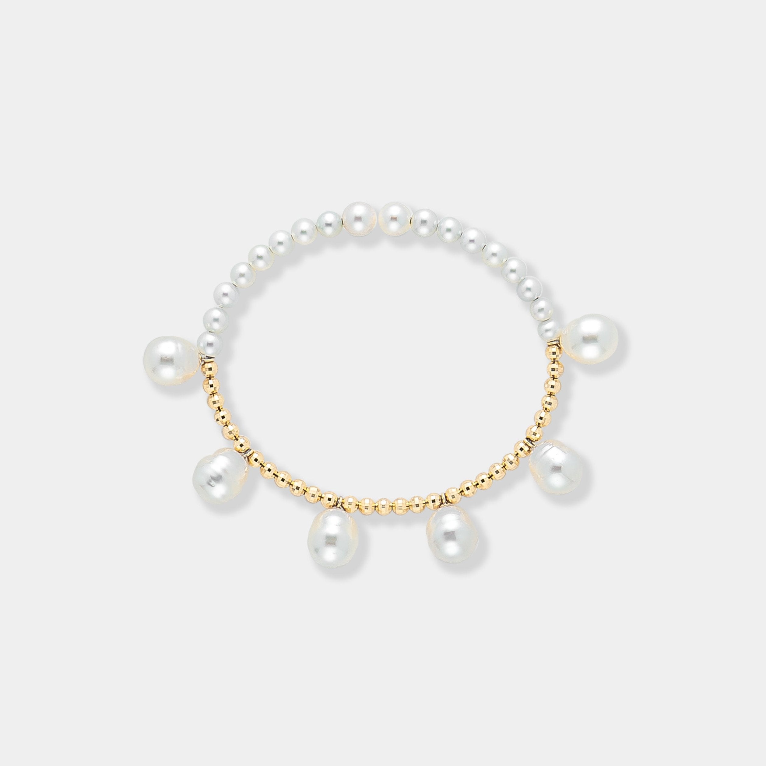 Elegant pearl bracelet with gold beads on a white background. Perfect for adding a touch of sophistication to any outfit.