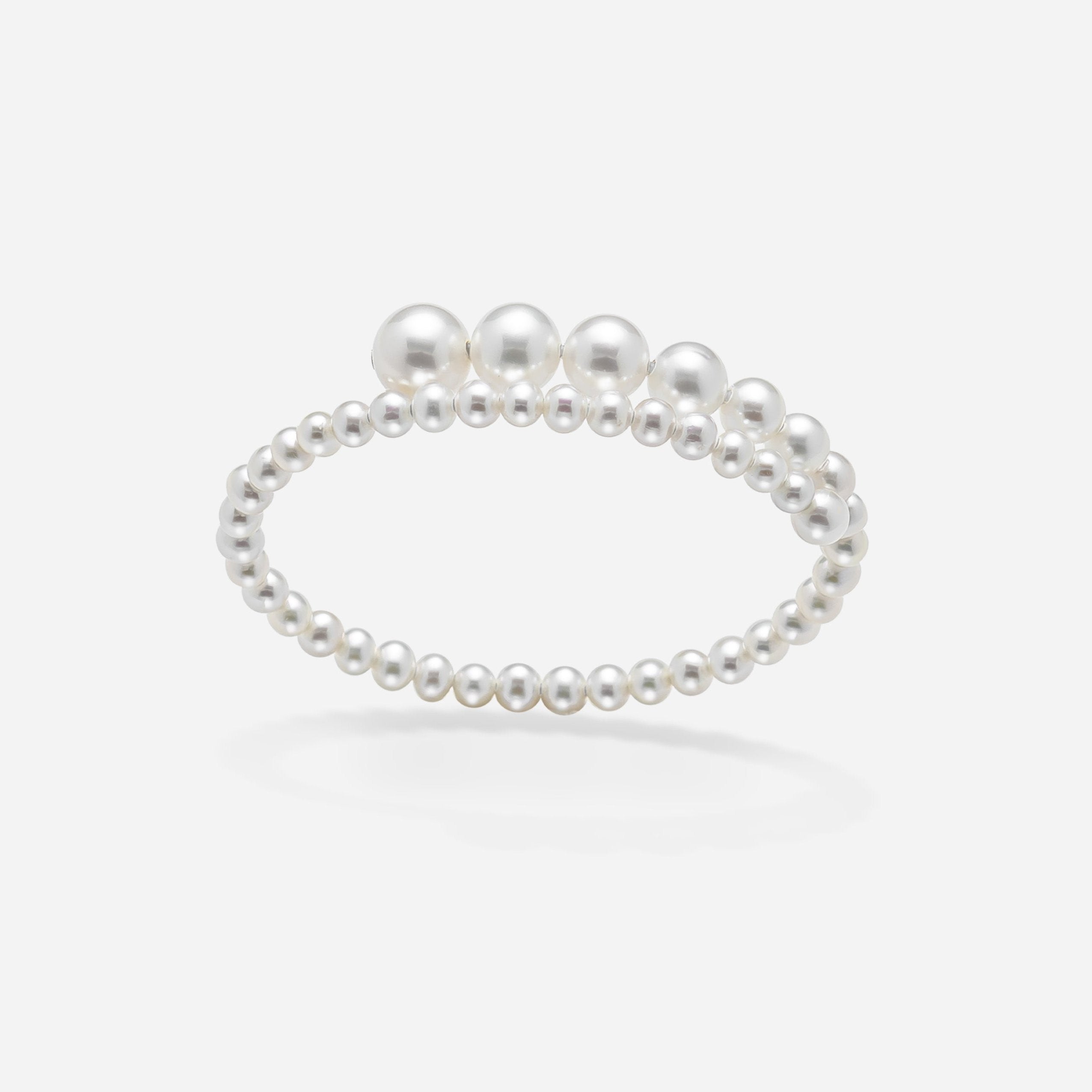 Stunning pearl bracelet against a white backdrop, a timeless piece that exudes class and elegance.