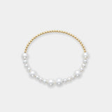 Beautiful white pearl bracelet with 18k yellow gold beads, combining elegance and sophistication in one piece.