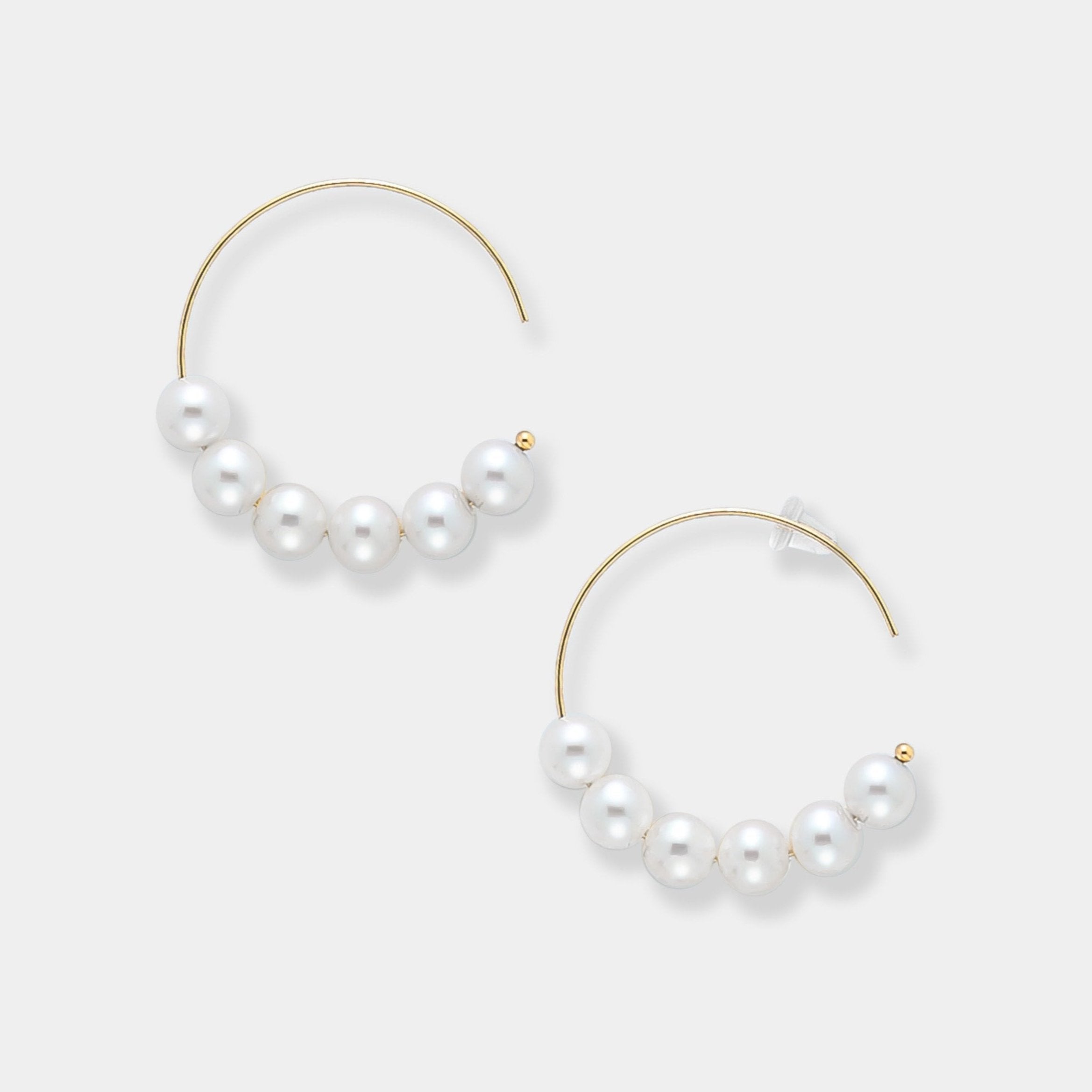 Enhance your style with elegance. The 18K gold hoop with brilliant freshwater pearls are a must have.