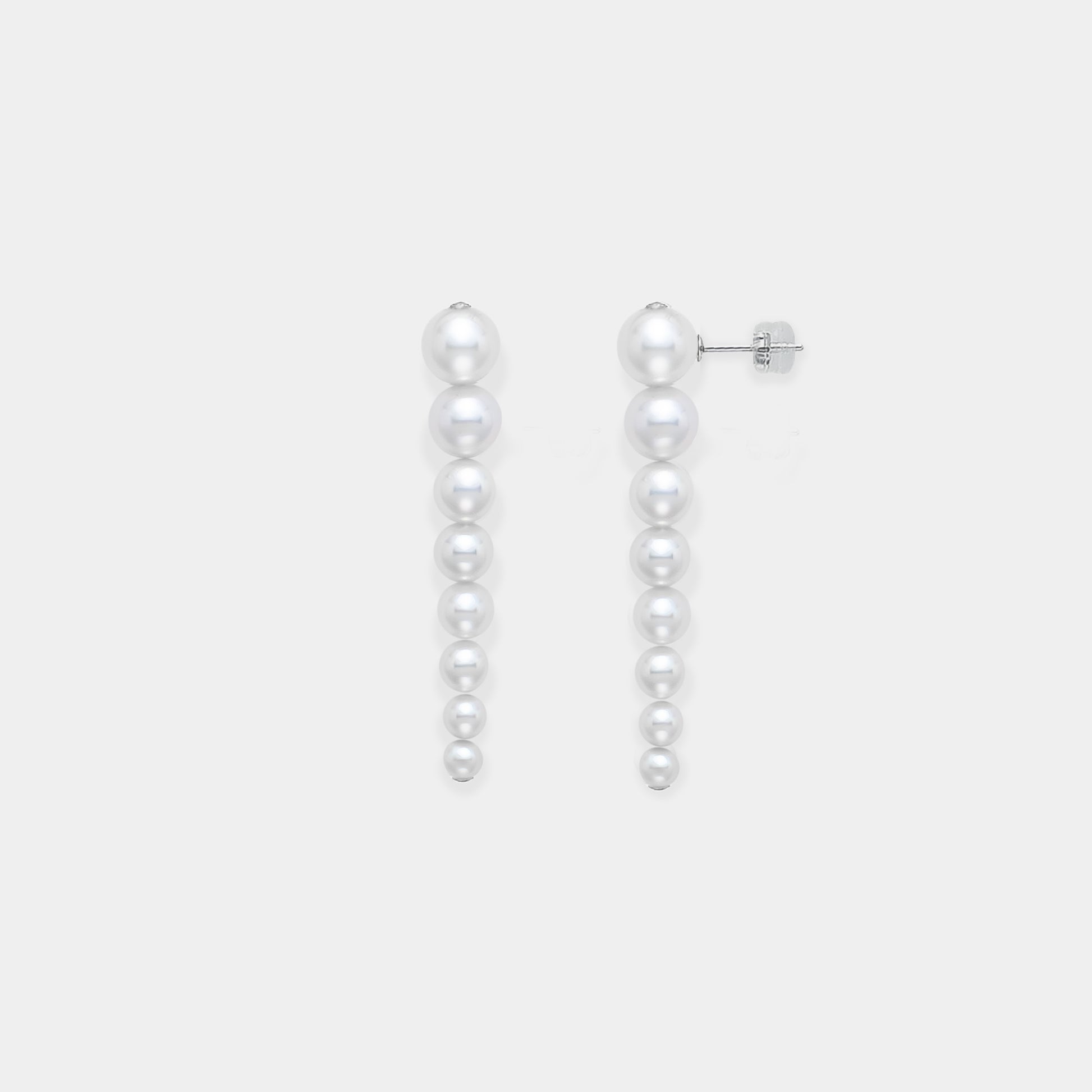 Enhance your elegance with Stella Piercing's exquisite pearl earrings on a pristine white background.