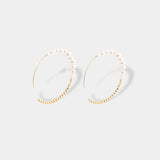 Stunning gold and pearl hoop earrings, a chic and timeless addition to your jewelry collection.