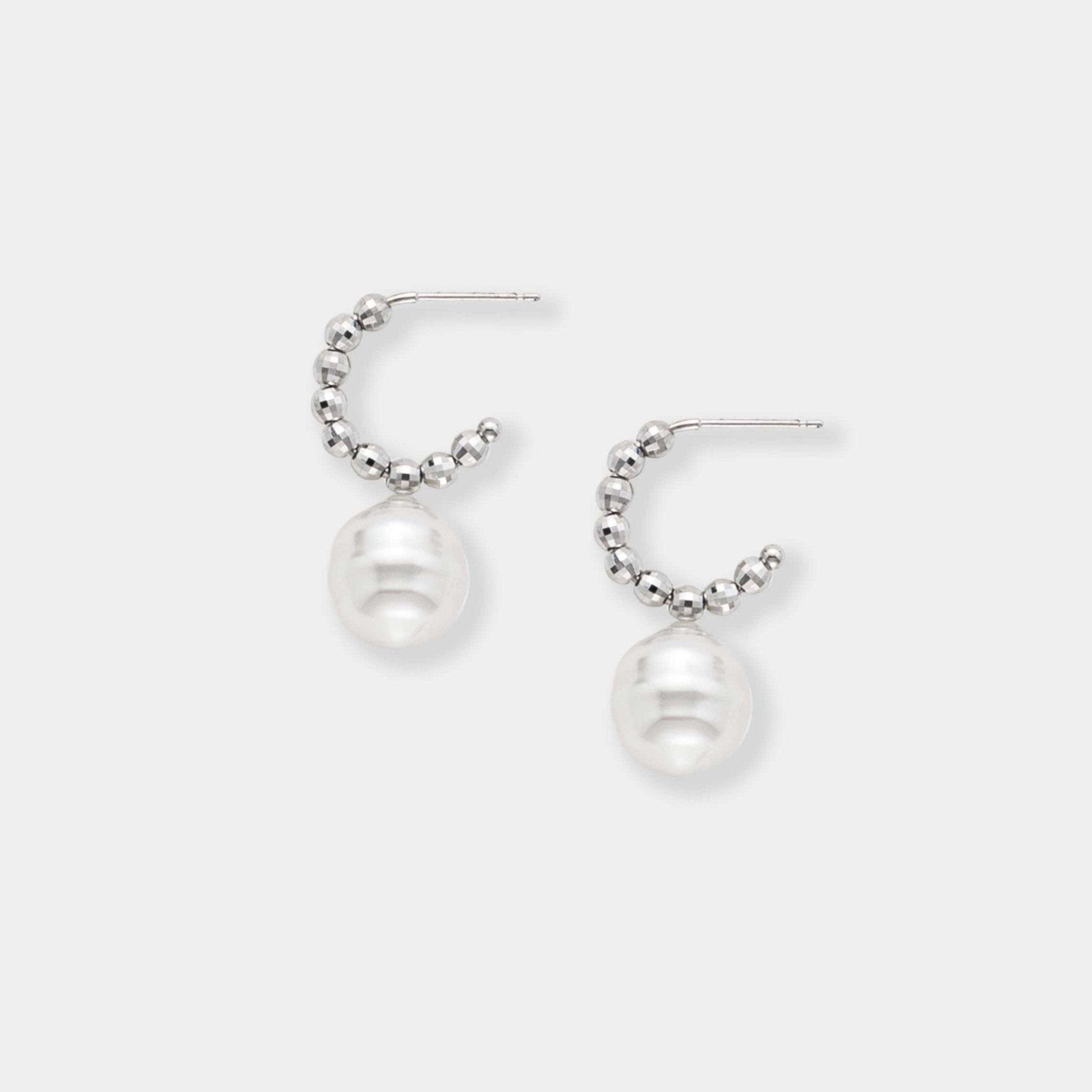 Indulge in timeless beauty with these stunning white pearl and white gold beads earrings. Elevate your style effortlessly.