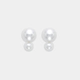 Two exquisite freshwater pearl earrings set in 18K yellow gold, elegantly presented on a bright white background.