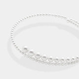 Spiral necklace using white fresh water pearls, using 14K white gold.