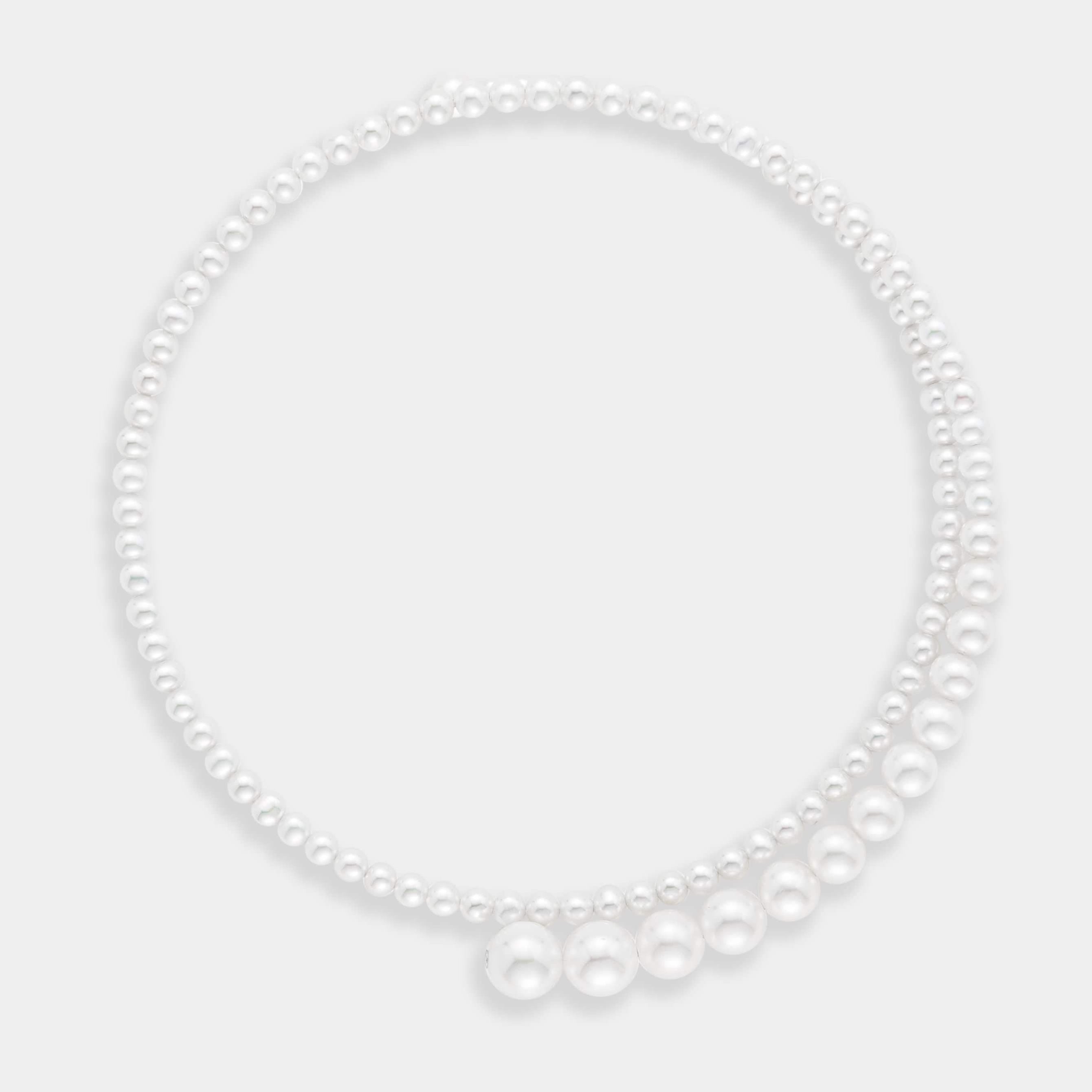 Spiral necklace using white fresh water pearls, using 14K white gold.