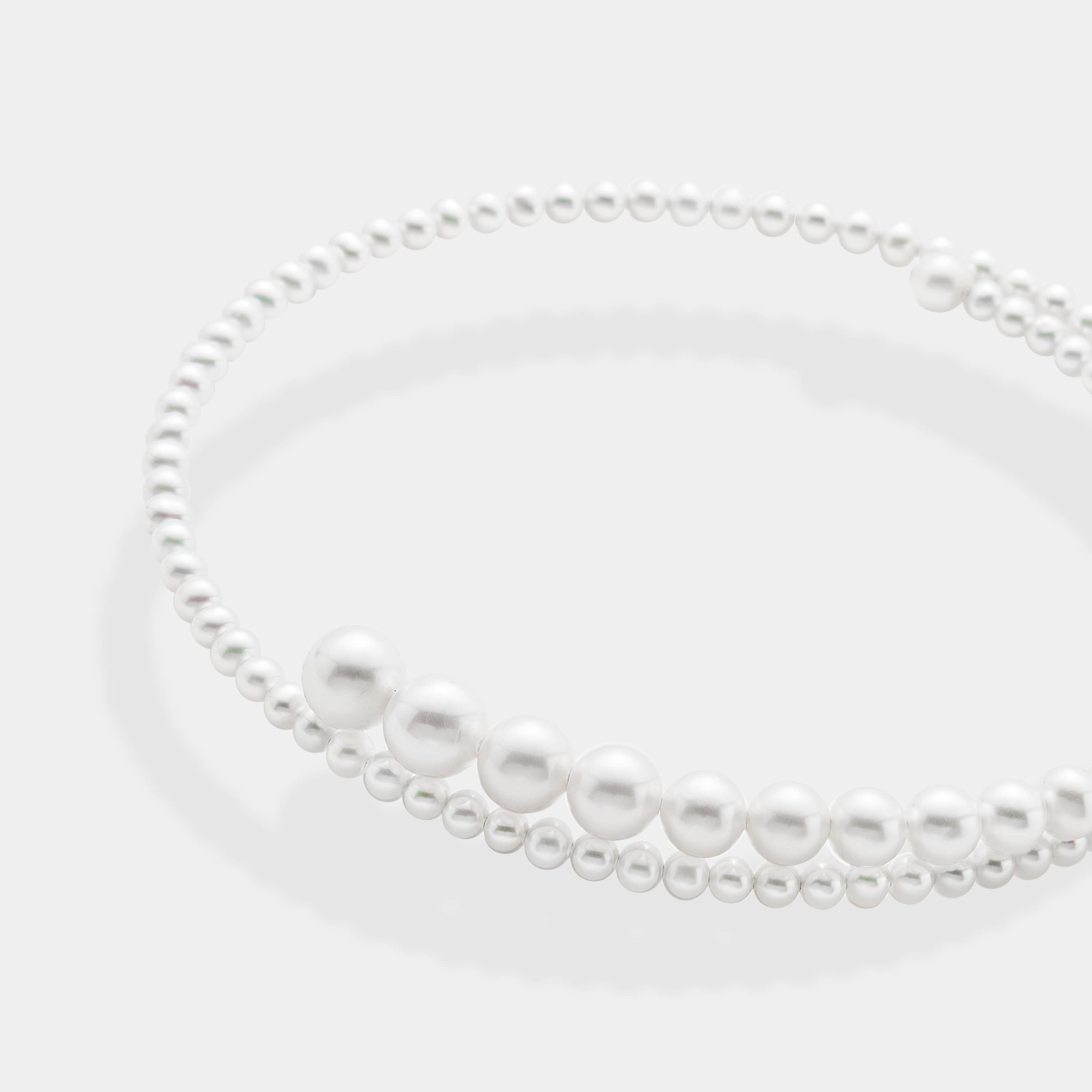 Spiral necklace using white fresh water pearls, using 14K white gold.