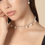 Embrace timeless beauty with a pearl necklace and piercing. A touch of luxury for the modern woman.