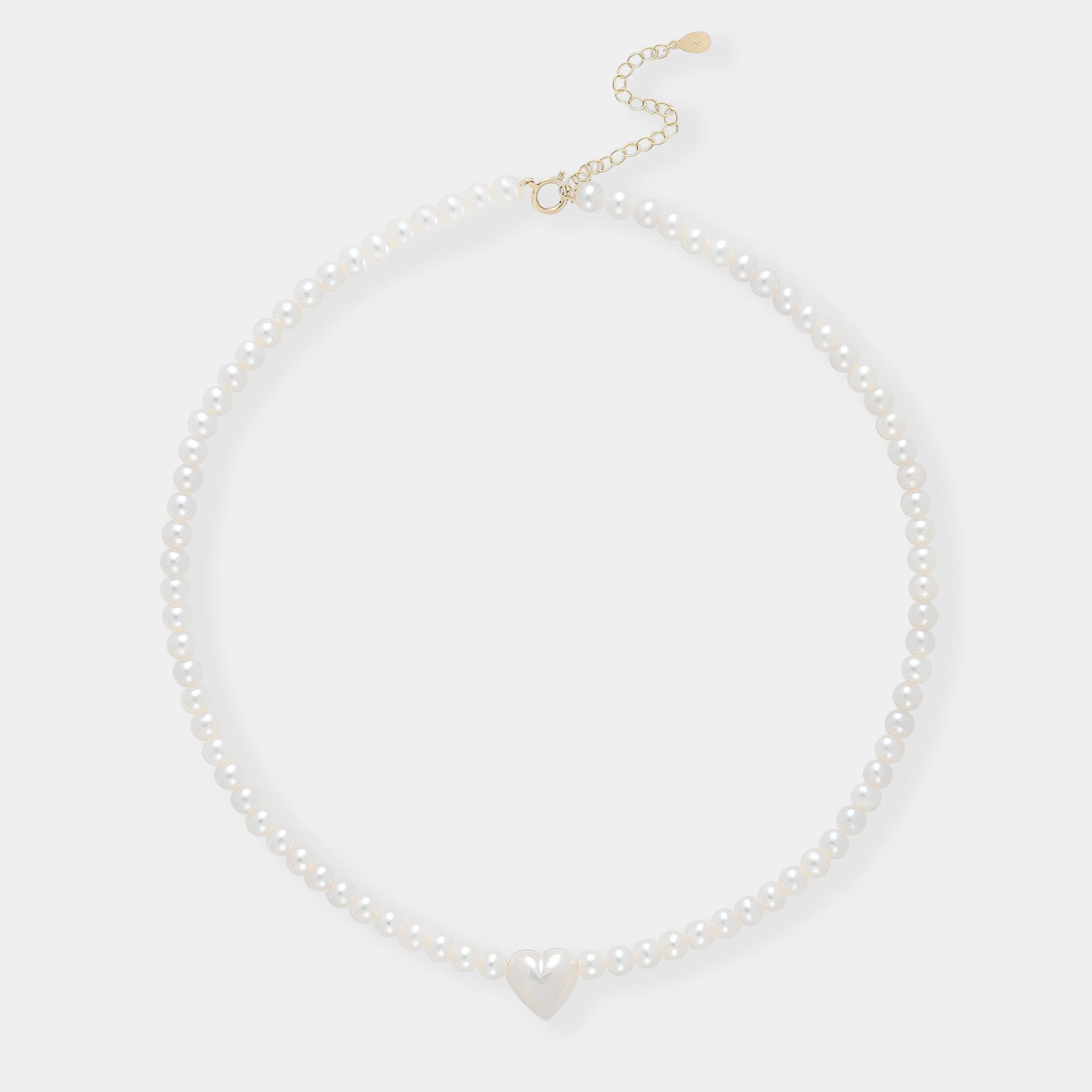 Elegant white pearl necklace with heart charm, perfect for adding a touch of romance to any outfit.