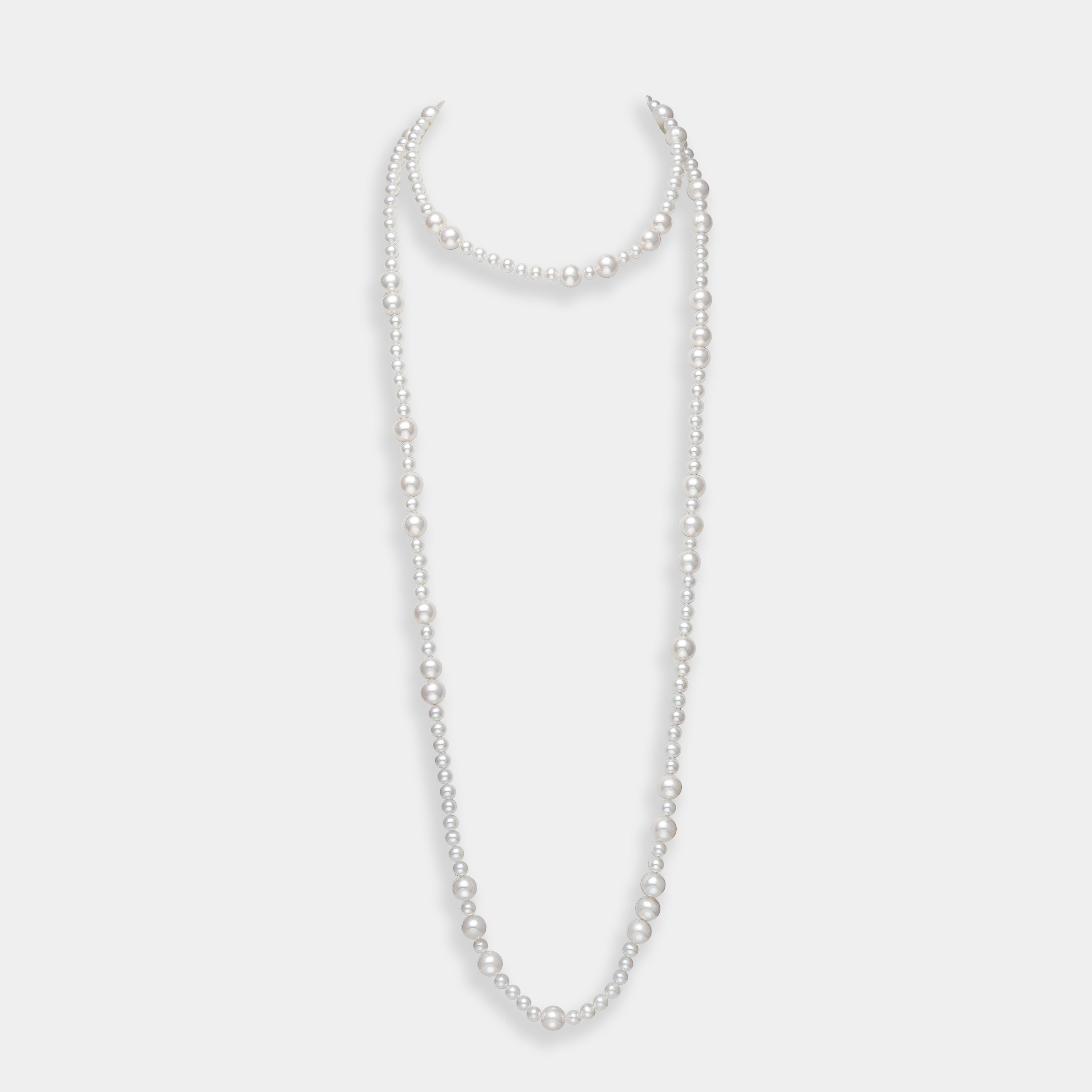 Elegant long freshwater pearl necklace with a silver clasp, a must-have piece for sophisticated elegance.