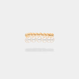 Elevate your style with the captivating Spiral Pearl x Gold Ring, gracefully showcased on a woman's hands.