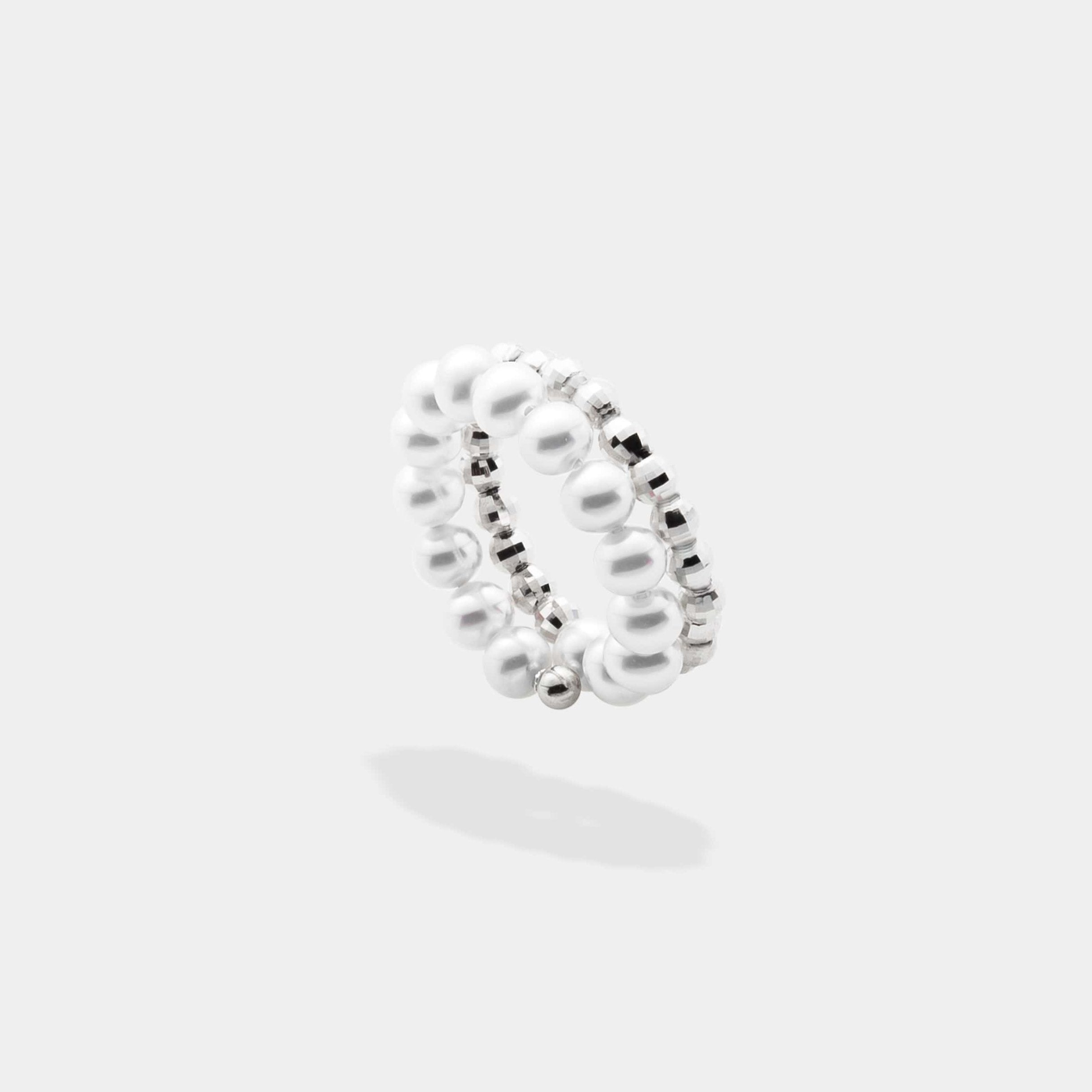 Elevate your look with our stunning Spiral Pearl x White Gold Ring, a timeless accessory that exudes grace and beauty.