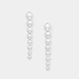 Enhance your elegance with Stella Piercing's exquisite pearl earrings on a pristine white background.