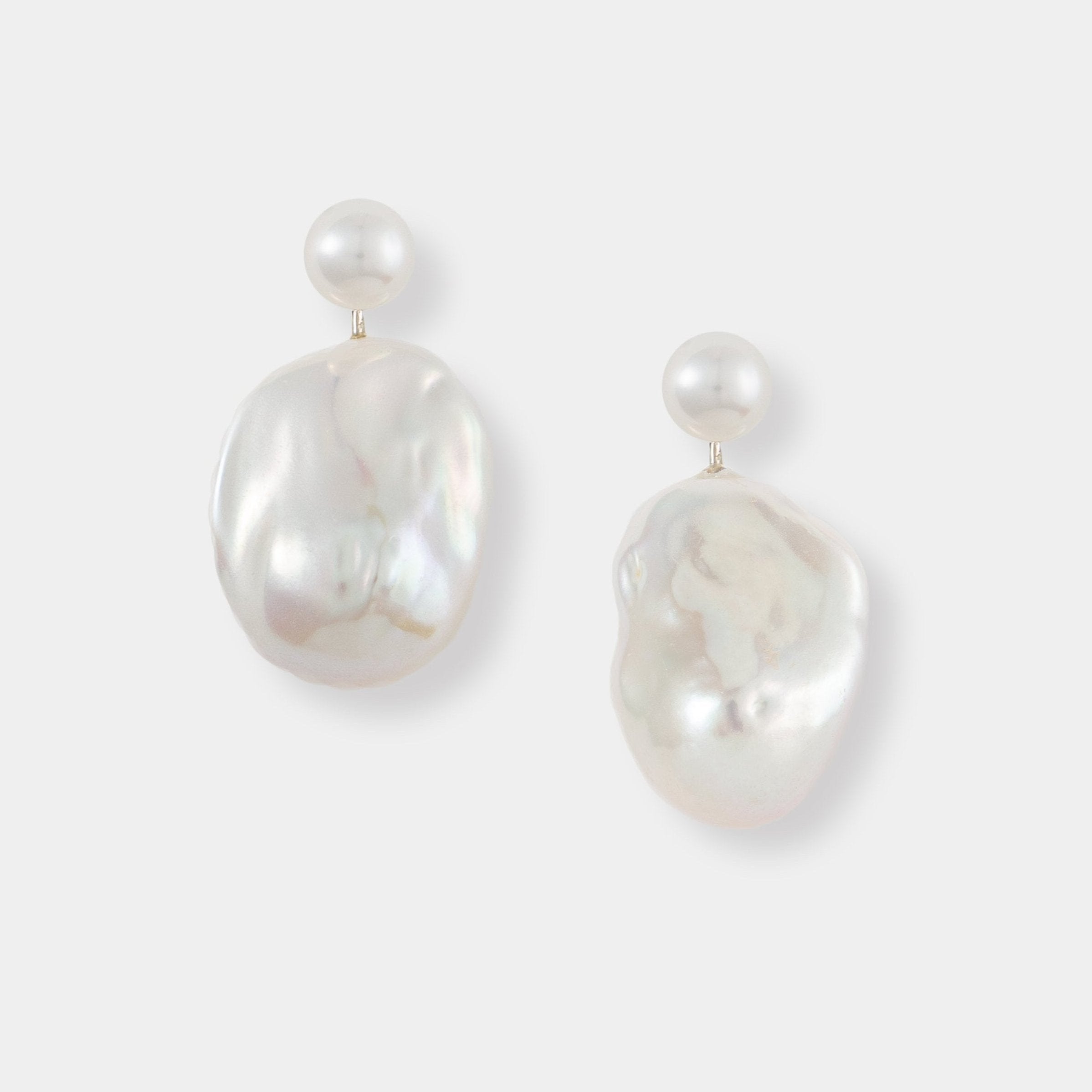 Elegant white Baroque Pearl Charm Piercing earrings, perfect for adding a touch of sophistication to any outfit.