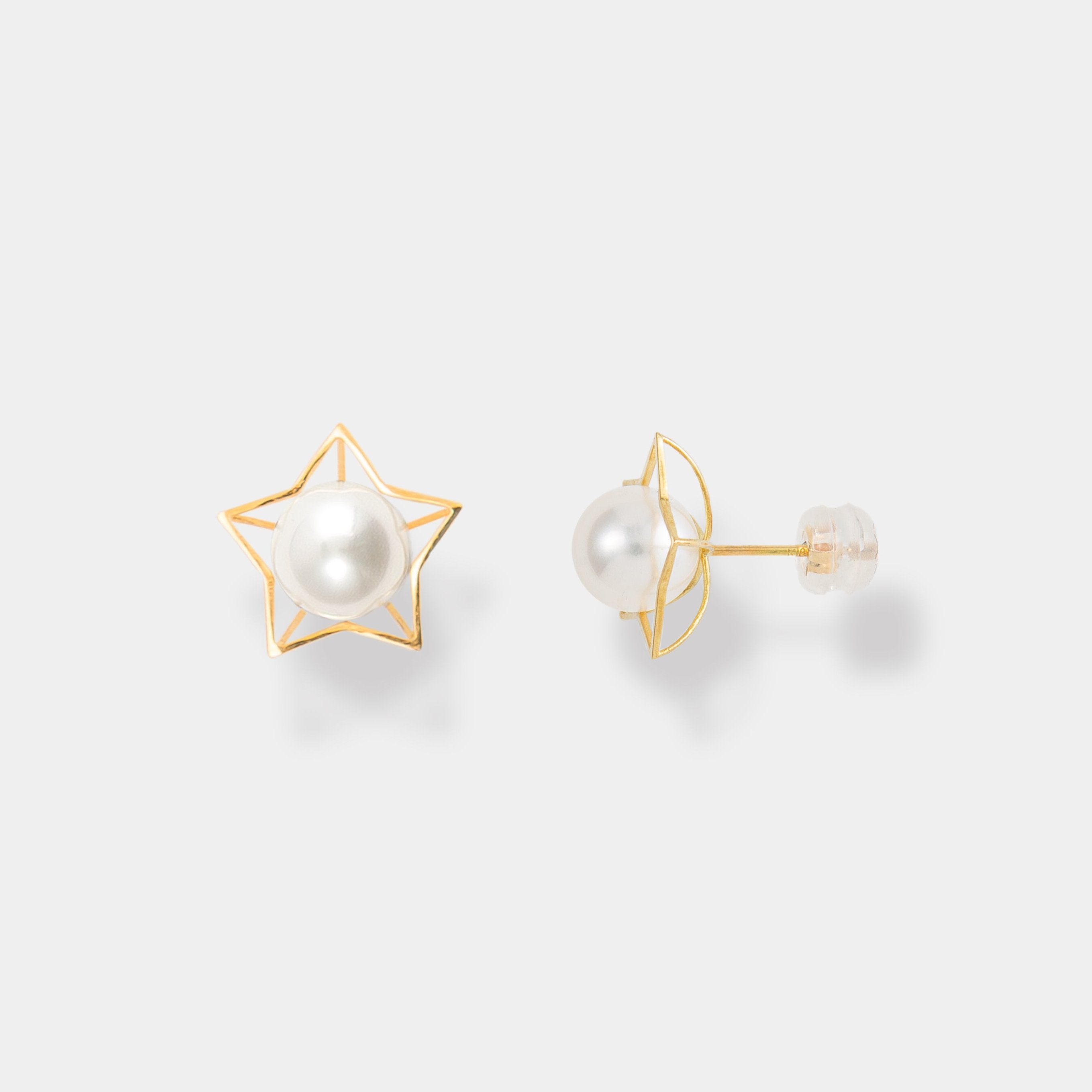 Elevate your style with these chic gold star stud earrings adorned with a classic pearl detail.