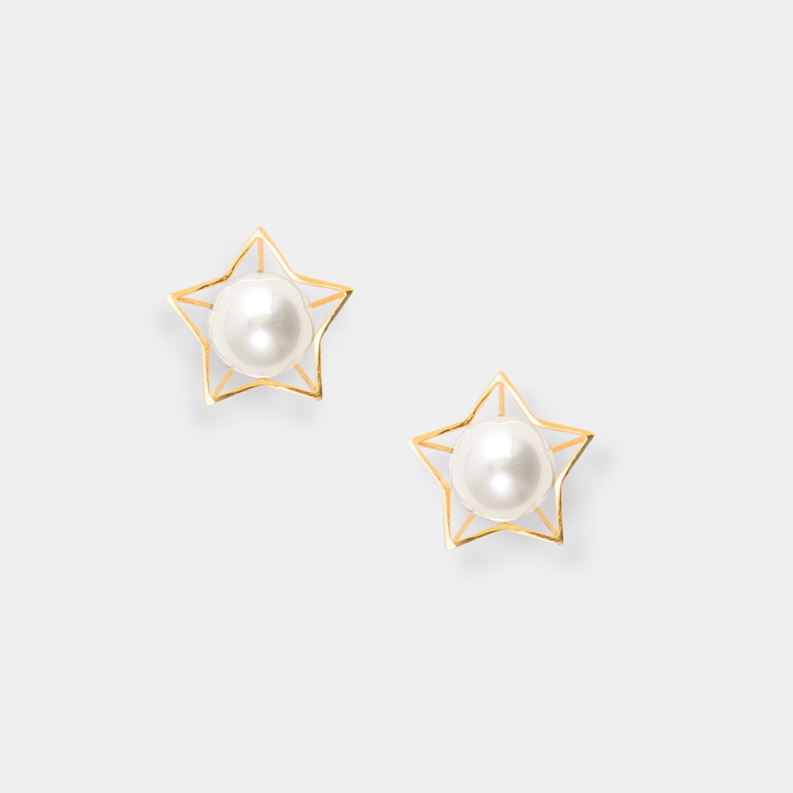 Elegant gold star stud earrings with a lustrous pearl - perfect for adding a touch of sophistication to any outfit.