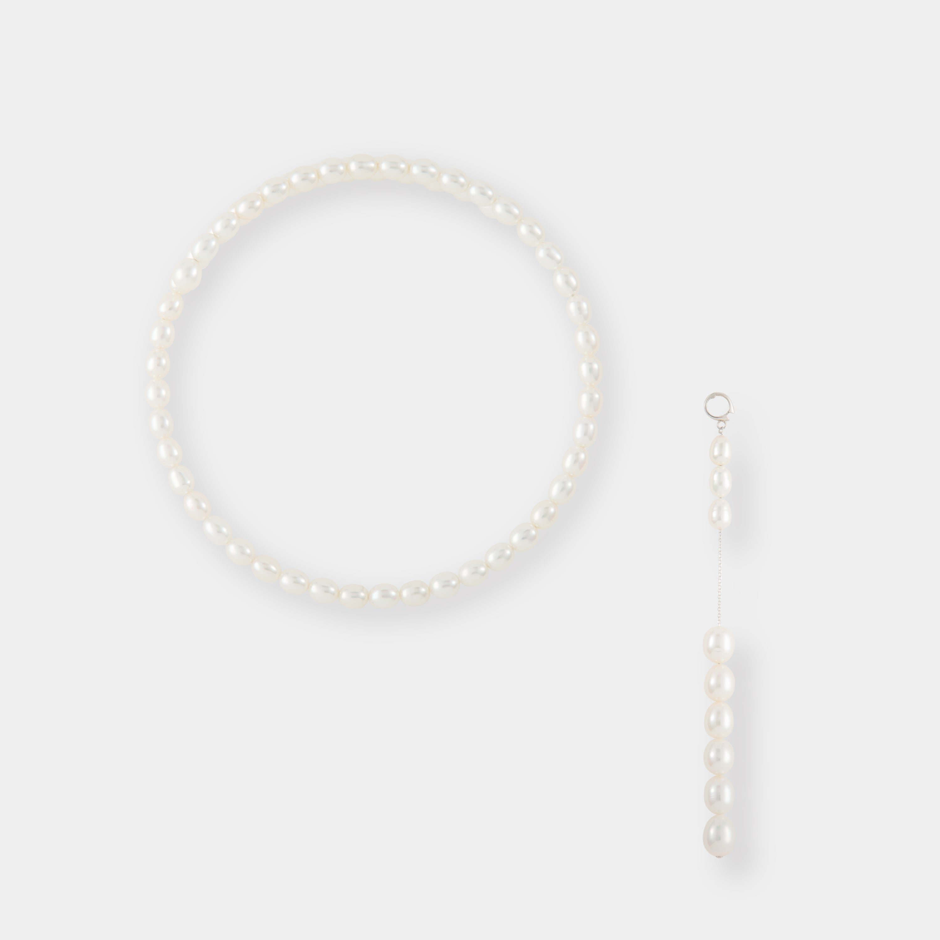 Indulge in sophistication with our pearl necklace, boasting a chain and a mesmerizing pearl drop. Experience the allure of our Oval Pearl Charm Choker.