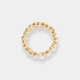 Add a touch of glamour with this exquisite gold and white pearl ring featuring a unique spiral design.